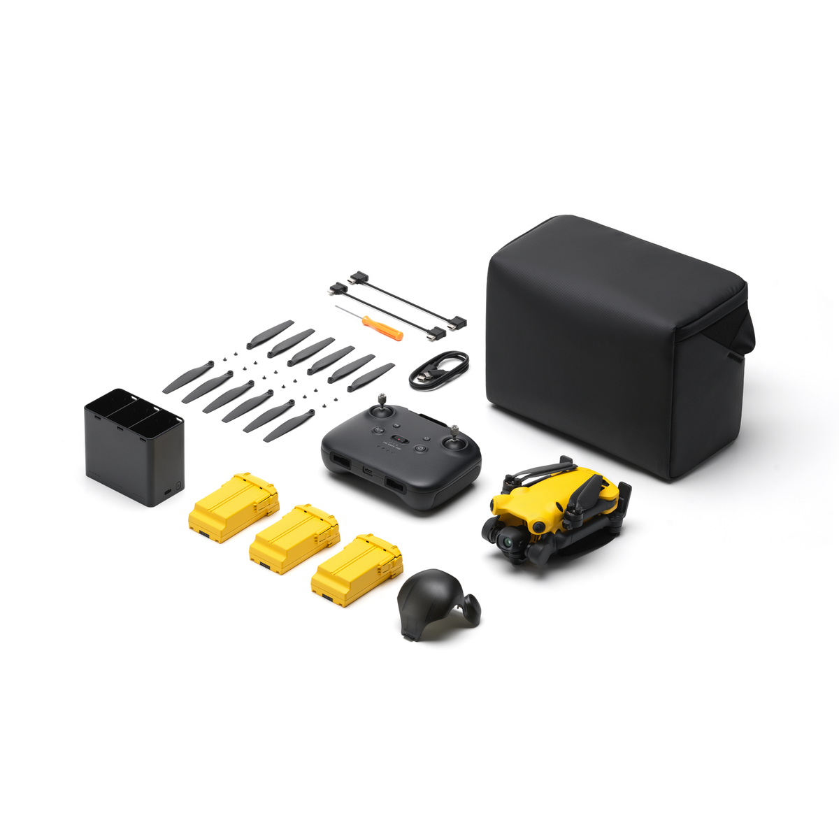 SKYROVER X1 Combo kit with yellow drone, controller, three batteries, charging hub, spare propellers and carrying bag.