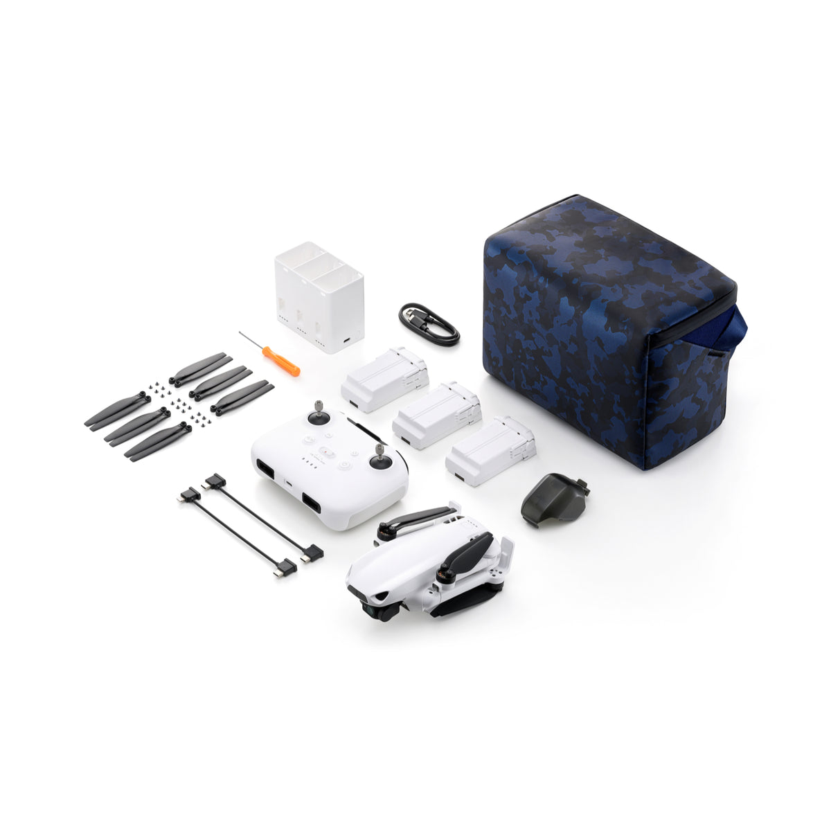 SKYROVER S1 Combo kit with white drone, controller, three batteries, charging hub and blue camouflage carrying bag.